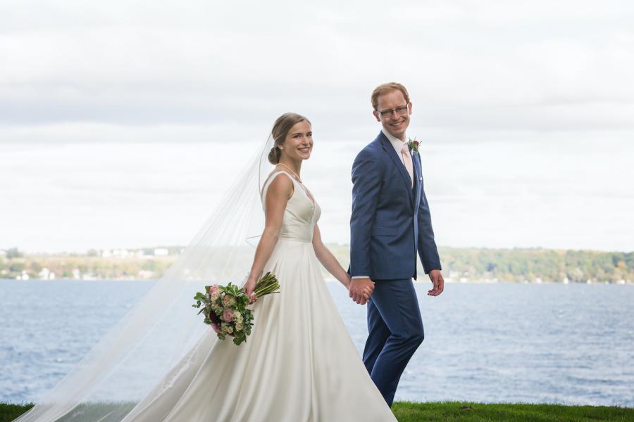 Wedding picture of Anya and Brad with a lake in the background