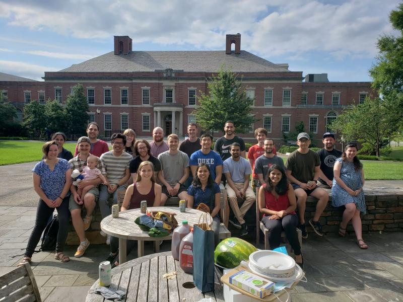 A group photo of the chilkoti lab outside with Daria and Nikita's daughter, Nika, for her first birthday